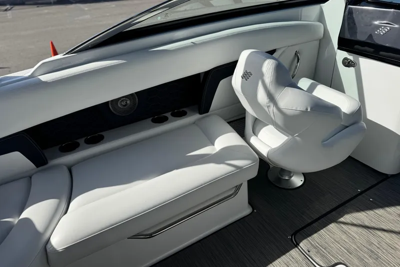 Slide: The Image of Interior of 2026 Four Winns HD8 OB boat with white seating and modern design. - 21