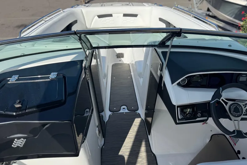 Slide: The Image of 2026 Four Winns HD8 OB boat interior with sleek dashboard and open cockpit view. - 28