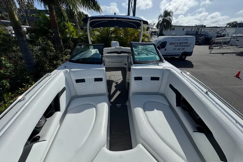 Slide: The Image of 2026 Four Winns HD8 OB boat interior with white seating and open windshield. - 32