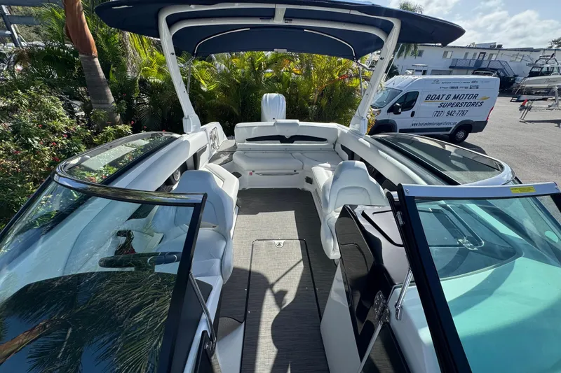 Slide: The Image of 2026 Four Winns HD8 OB boat interior with seating, open deck, and canopy. - 33