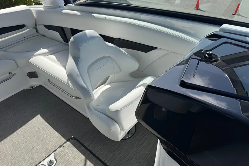 Slide: The Image of 2026 Four Winns HD8 OB boat interior with white seating and sleek design. - 36