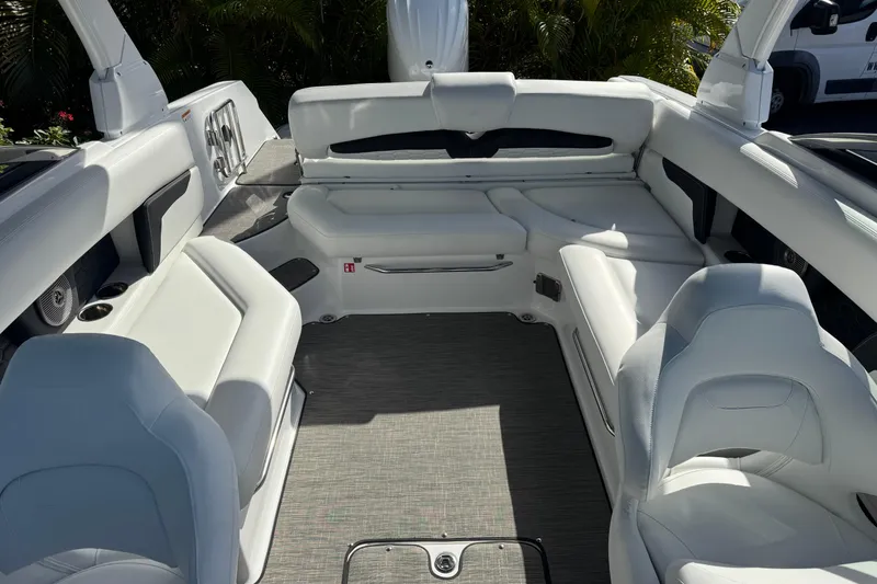 Slide: The Image of Interior of 2026 Four Winns HD8 OB boat with white seating and modern design. - 37
