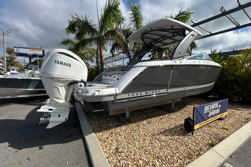 Slide: The Image of 2026 Four Winns H9 OB boat with Yamaha engine displayed outdoors. - 3