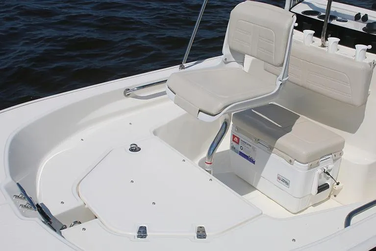 Slide: The Image of 2026 Boston Whaler 150 Montauk boat interior with steering console and seating. - 8