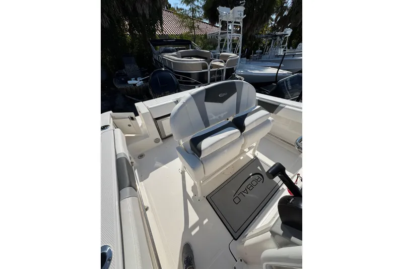Slide: The Image of 2024 Robalo R230 Center Console boat interior with seating and console details. - 4