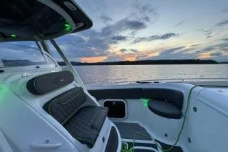 Slide: The Image of 2023 Glasstream 328 SCX boat interior at sunset on the water. - 21