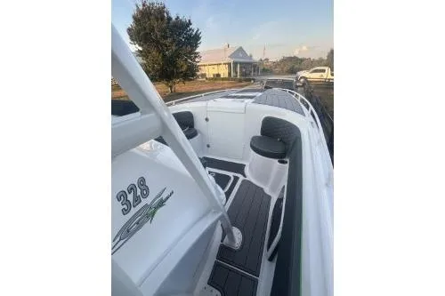 Slide: The Image of 2023 Glasstream 328 SCX boat with sleek design and modern seating. - 26