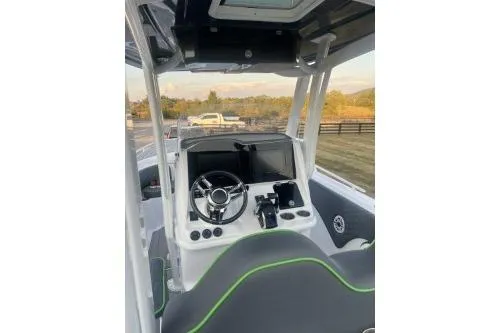 Slide: The Image of 2023 Glasstream 328 SCX boat cockpit with modern steering and controls. - 31