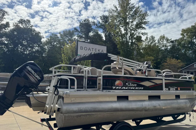 Slide: The Image of 2019 Sun Tracker Bass Buggy 18 DLX pontoon boat with Mercury engine at Boateka dealership. - 2