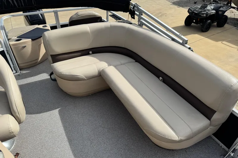 Slide: The Image of 2019 Sun Tracker Bass Buggy 18 DLX pontoon boat with beige seating and spacious interior. - 4