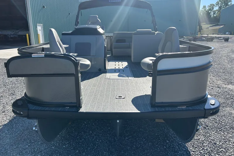 Slide: The Image of 2026 Premier 230 Sunsation Angler 4pt pontoon boat, rear view, outdoor setting. - 10
