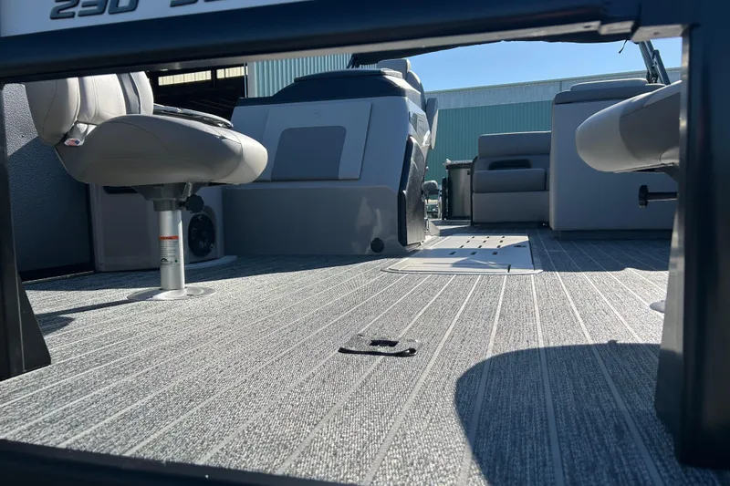 Slide: The Image of Interior view of 2026 Premier 230 Sunsation Angler 4pt boat with seating and flooring. - 11