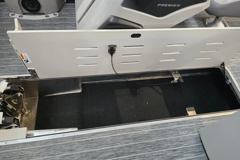 Slide: The Image of 2026 Premier 230 Sunsation Angler 4pt boat storage compartment with open hatch. - 18