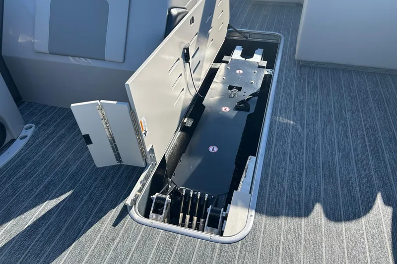 Slide: The Image of Open storage compartment on 2026 Premier 230 Sunsation Angler 4pt boat deck. - 19