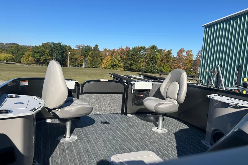 Slide: The Image of 2026 Premier 230 Sunsation Angler 4pt boat interior with seating and fishing setup. - 26