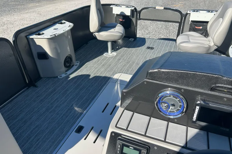 Slide: The Image of 2026 Premier 230 Sunsation Angler 4pt boat interior with seating and control panel. - 27