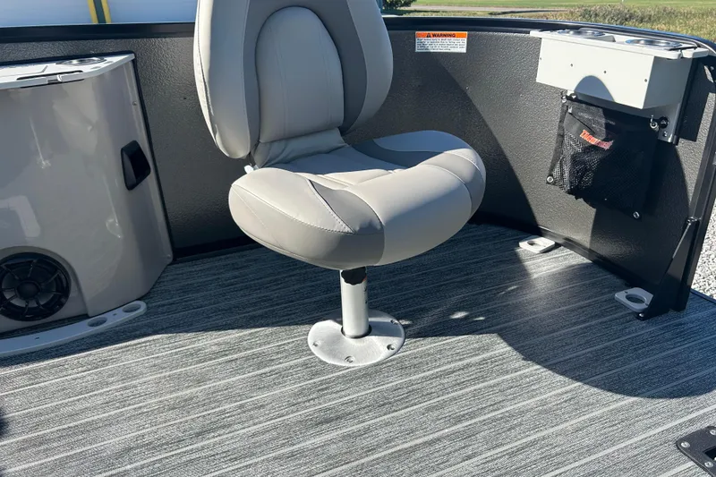 Slide: The Image of Premier 230 Sunsation Angler 4pt 2026 boat interior with cushioned seat and storage. - 29