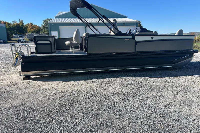 Slide: The Image of 2026 Premier 230 Sunsation Angler 4pt pontoon boat on gravel lot. - 3