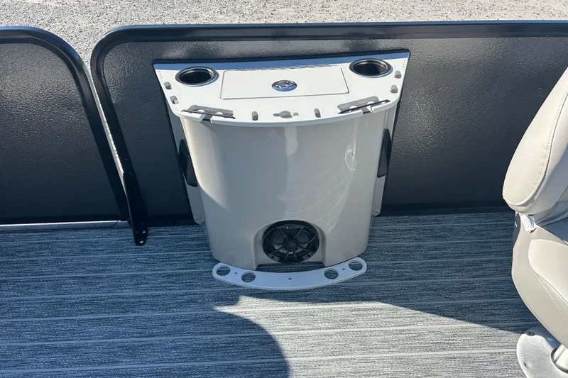 Slide: The Image of 2026 Premier 230 Sunsation Angler 4pt boat interior with cup holders and speaker. - 30