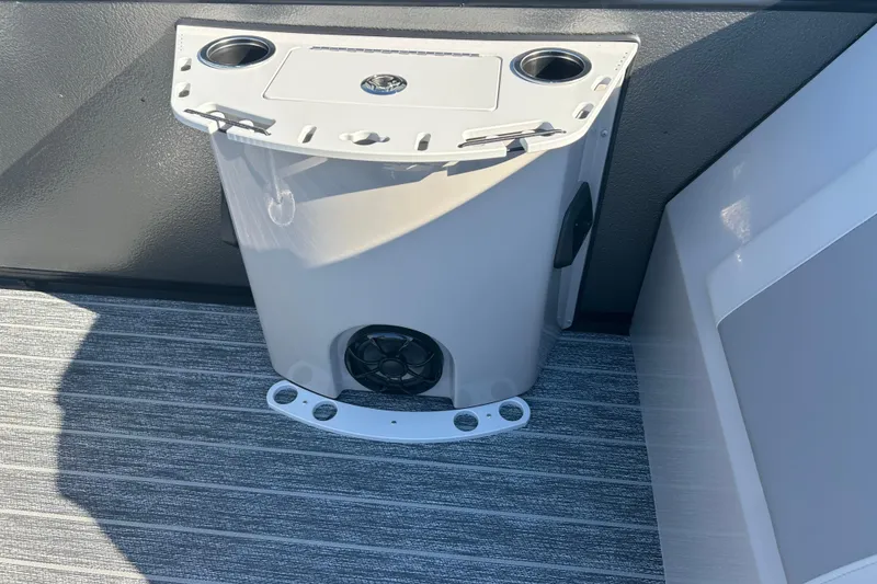 Slide: The Image of 2026 Premier 230 Sunsation Angler 4pt boat interior with cup holders and speaker. - 31