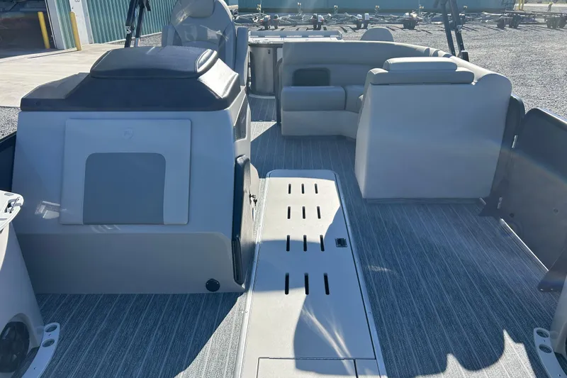 Slide: The Image of 2026 Premier 230 Sunsation Angler 4pt boat interior with seating and storage compartments. - 32
