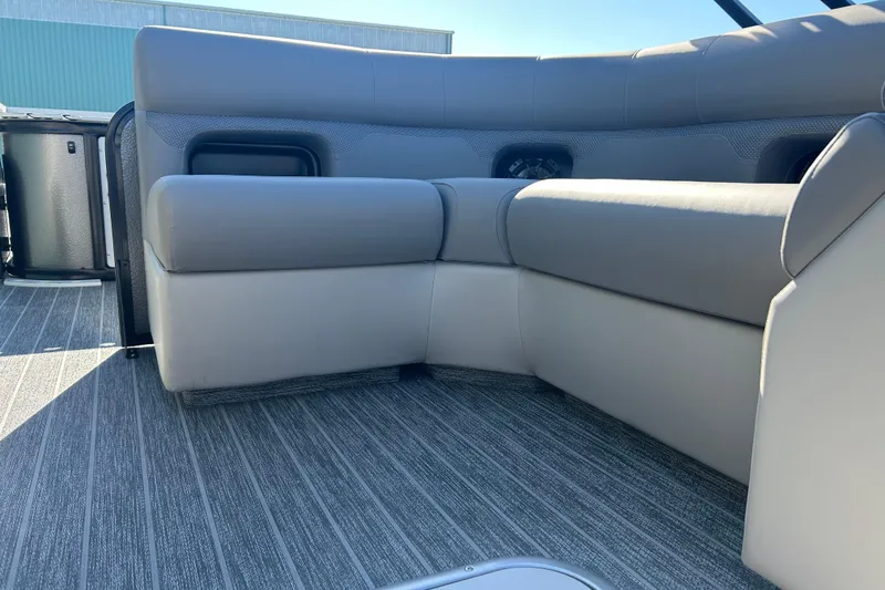 Slide: The Image of Premier 230 Sunsation Angler 4pt 2026 boat interior with gray seating and flooring. - 35