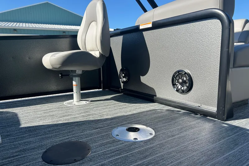 Slide: The Image of Premier 230 Sunsation Angler 4pt 2026 boat interior with seating and speakers. - 36