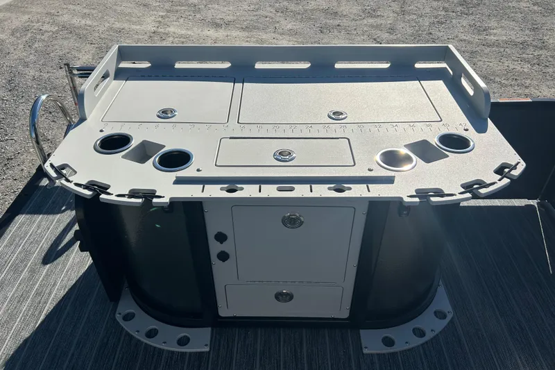 Slide: The Image of 2026 Premier 230 Sunsation Angler 4pt fishing station with cup holders and storage compartments. - 38