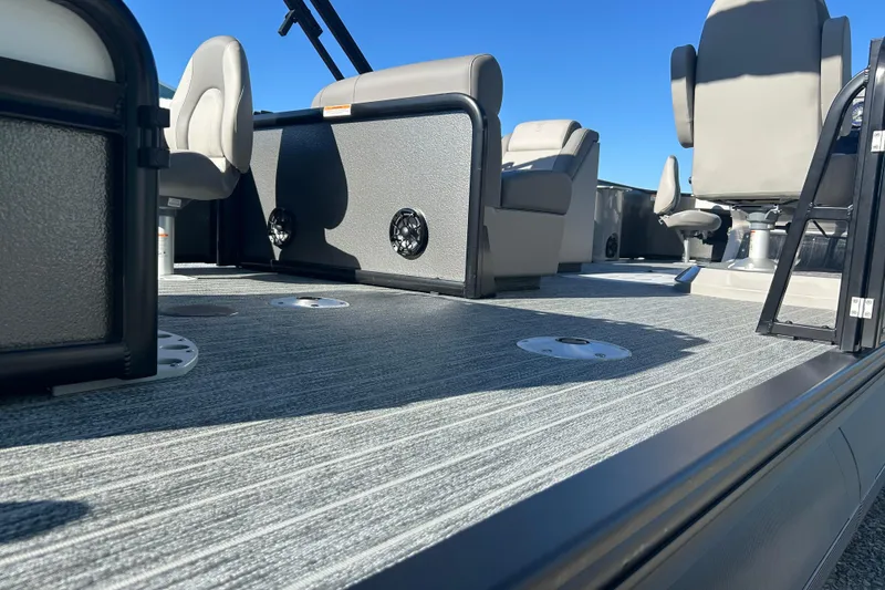 Slide: The Image of 2026 Premier 230 Sunsation Angler 4pt boat interior with modern seating and flooring. - 4