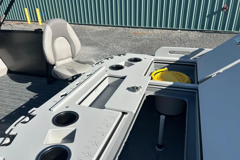 Slide: The Image of 2026 Premier 230 Sunsation Angler 4pt boat interior with storage compartments and seating. - 40