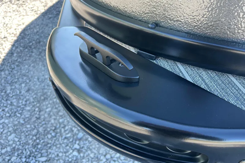 Slide: The Image of Close-up of 2026 Premier 230 Sunsation Angler 4pt boat cleat on textured surface. - 45