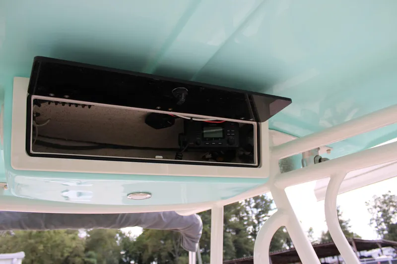 Slide: The Image of 2022 Sea Chaser 24 HFC boat console with electronic equipment storage. - 11