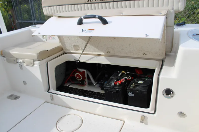 Slide: The Image of 2022 Sea Chaser 24 HFC boat battery compartment with open hatch. - 14