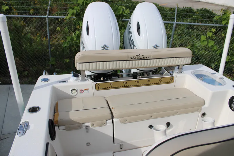 Slide: The Image of 2022 Sea Chaser 24 HFC boat with dual engines and beige seating. - 16