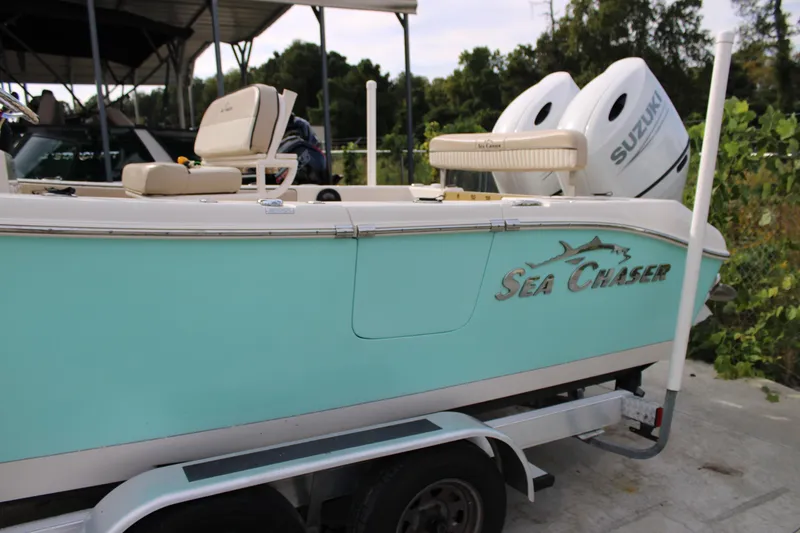 Slide: The Image of 2022 Sea Chaser 24 HFC boat with Suzuki engines on a trailer. - 3