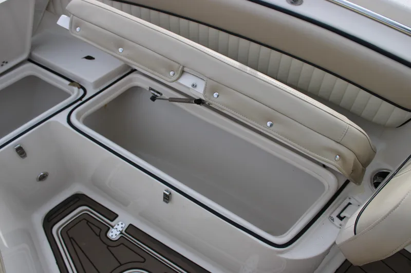 Slide: The Image of 2022 Sea Chaser 24 HFC boat storage compartment with cushioned seating. - 5