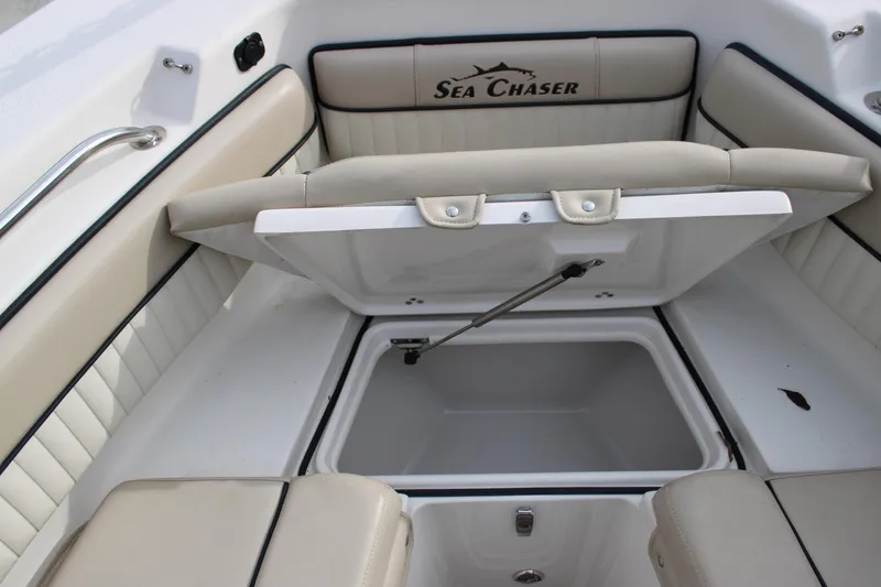 Slide: The Image of 2022 Sea Chaser 24 HFC boat interior with open storage compartment. - 6