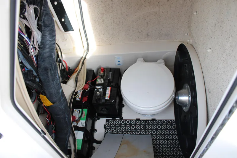 Slide: The Image of Interior of 2022 Sea Chaser 24 HFC boat showing toilet and battery compartment. - 8