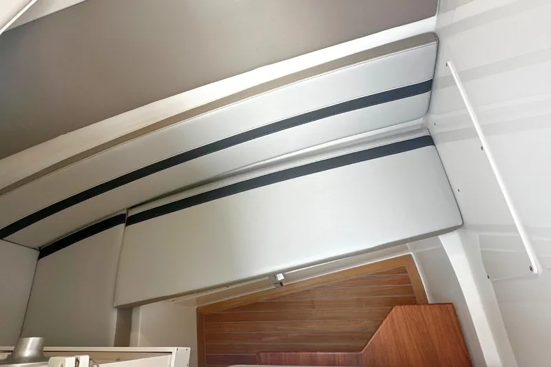 Slide: The Image of Interior view of 2026 Boston Whaler 330 Vantage boat cabin ceiling. - 28