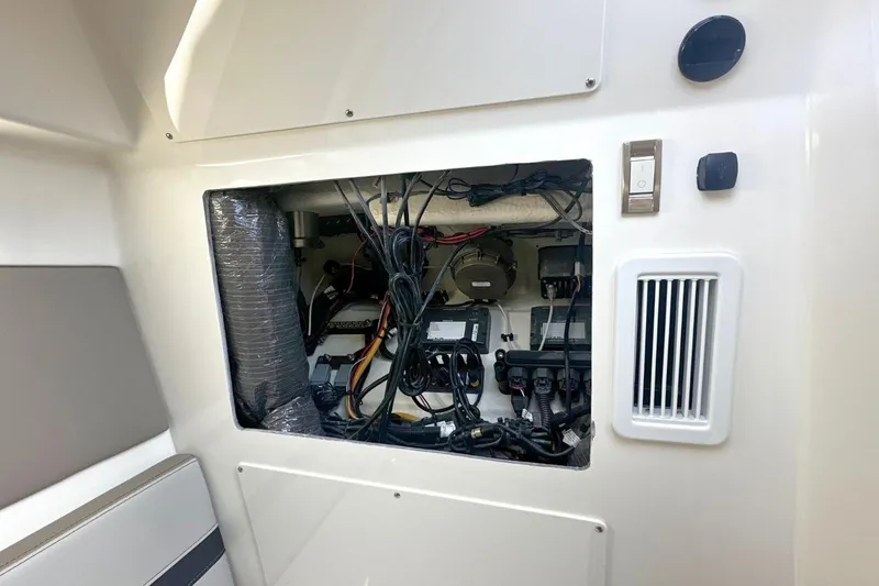 Slide: The Image of 2026 Boston Whaler 330 Vantage interior wiring and control panel. - 29