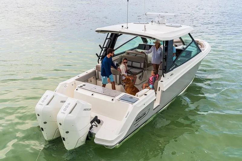 Slide: The Image of 2026 Boston Whaler 330 Vantage boat deck with swim platform and ladder. - 3