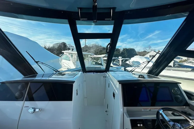 Slide: The Image of Interior view of 2026 Boston Whaler 330 Vantage boat cockpit with modern controls. - 30