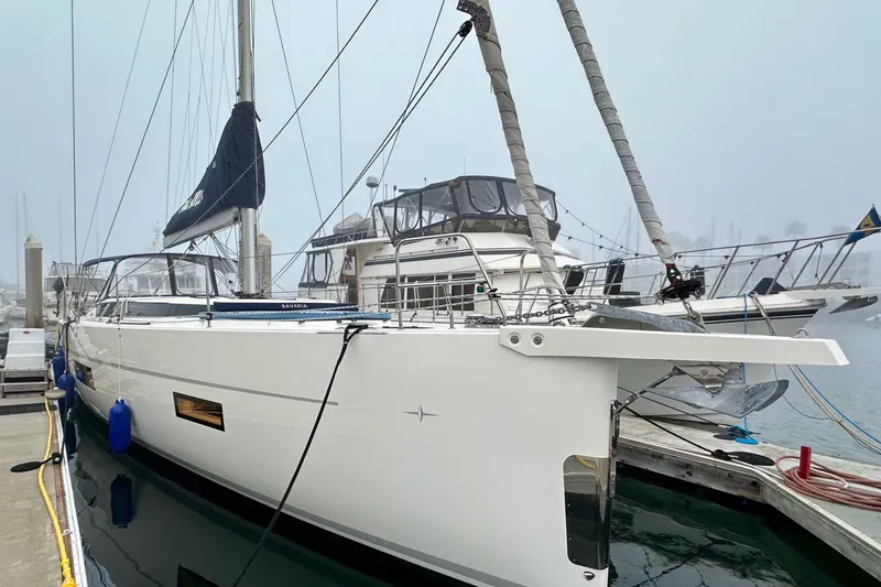 Slide: The Image of 2020 Bavaria C50 yacht docked at marina on a foggy day. - 10