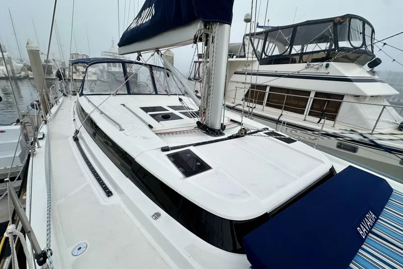 Slide: The Image of 2020 Bavaria C50 sailboat docked at marina, featuring sleek design and modern amenities. - 26