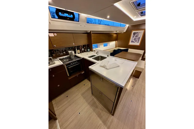 Slide: The Image of Luxurious 2020 Bavaria C50 yacht interior with modern kitchen and dining area. - 47