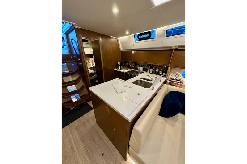 Slide: The Image of Luxurious interior of 2020 Bavaria C50 yacht featuring modern kitchen and cozy seating area. - 49