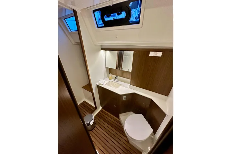 Slide: The Image of Luxurious 2020 Bavaria C50 yacht bathroom with modern fixtures and wooden accents. - 60