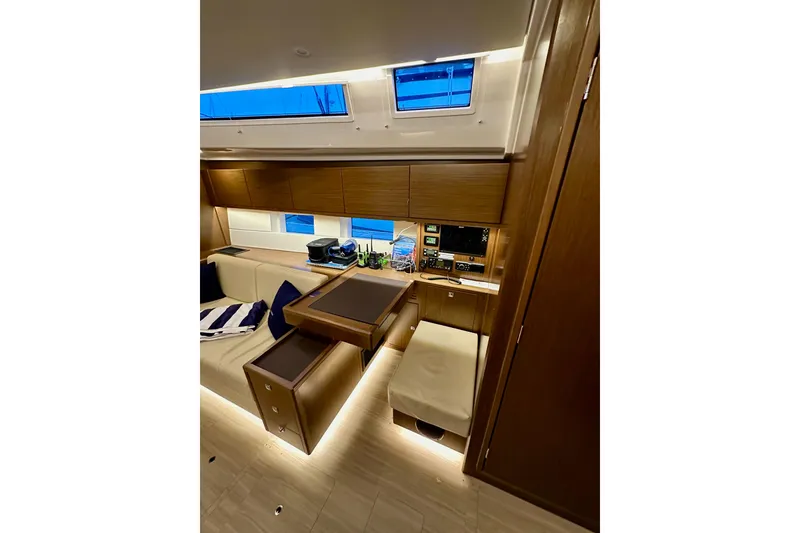 Slide: The Image of Luxurious interior of 2020 Bavaria C50 yacht with modern wood finish and seating area. - 63