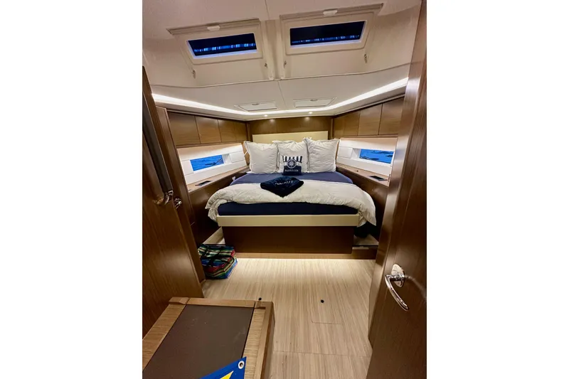 Slide: The Image of Luxurious interior cabin of 2020 Bavaria C50 yacht with cozy bedding and modern design. - 70