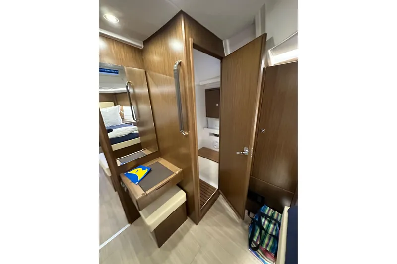 Slide: The Image of Interior of 2020 Bavaria C50 yacht with wooden finish and cozy cabin space. - 72